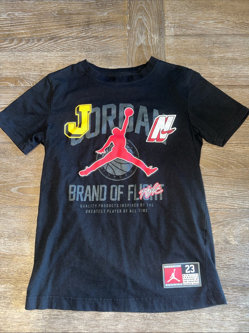 Jordan Black Short Sleeve Tee with Red, Yellow & White Graphics Youth Medium